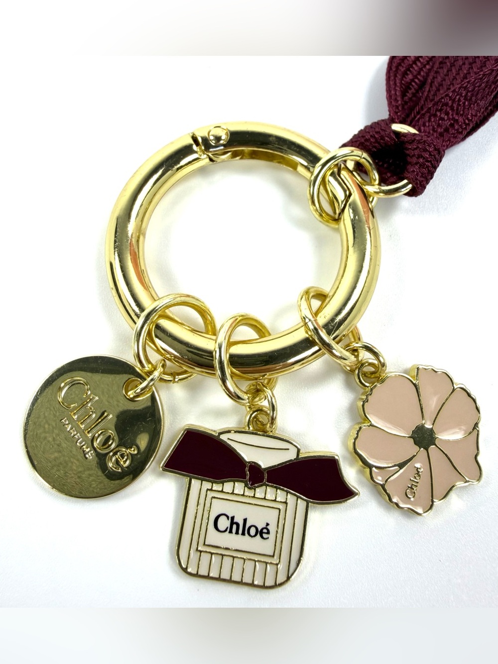 Chloé Parfums Gold Tone Bag Charm Keychain Perfume Flower Burgundy Ribbon